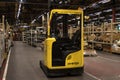 Hyster branded yellow forklift truck inside a factory industrial setting