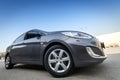 Hyundai accent in grey color, front side ultra wide angle view