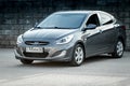 Hyundai accent in grey color, front side view. Royalty Free Stock Photo