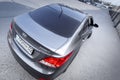 Hyundai accent in grey color, top and back view