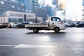 Hyundai H-100 cargo flatbed truck in the city street. Hyundai Porter 2 in fast motion with blurred background Royalty Free Stock Photo