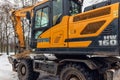 Hyundai wheel excavator with bucket filled with sand