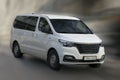 Hyundai white minibus.