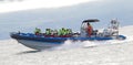 Tourists on speedboat during starting whale watching tour from HÃÂºsavik