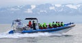 Tourists on speedboat during starting whale watching tour from HÃÂºsavik