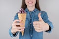 I adore new taste of ice cream concept. Cropped close up photo of satisfied joyful cute dreamy lovely lady giving you her approval