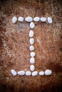 'I' alphabet made form white stone