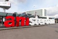 I am Amsterdam sign at the arrivaldeparture entrance of Schiphol international airport Royalty Free Stock Photo