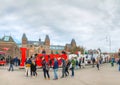 I Amsterdam slogan with crowd of tourists