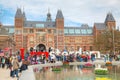 I Amsterdam slogan with crowd of tourists