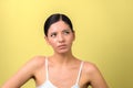 Am i beautiful. beauty woman thinking and looking up  on yellow background Royalty Free Stock Photo