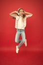 I believe i can fly. Girl listening music modern gadget. Kid happy with wireless headset dancing jumping. Stereo Royalty Free Stock Photo