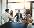 I believe youre the person to thank. businesspeople shaking hands in a boardroom meeting. Royalty Free Stock Photo