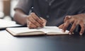 I better make a note of that. Closeup shot of an unrecognisable businessman writing in a notebook in an office. Royalty Free Stock Photo