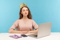 I am big boss. Proud self-confident authoritative businesswoman wearing crown on head, sitting in her office workplace Royalty Free Stock Photo