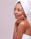 I can always count on the spa to relax me. An isolated studio shot of a beautiful young woman wearing a towel on her Royalty Free Stock Photo