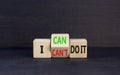 I can do it symbol. Concept word I can or can not do it on beautiful wooden cubes. Beautiful black table black background.