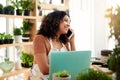 I can have that ready for you within the hour. an attractive young female botanist making a phonecall while working on a