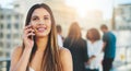 I can hear you. an attractive young woman making a phone call while standing outside. Royalty Free Stock Photo