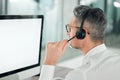 I can hear you loud and clear. an unrecognisable customer service agent sitting alone in the office and using his Royalty Free Stock Photo