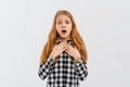 I can not believe it. Excited surprised teen girl looks with terror at camera as notices something unexpected or hears bad news, Royalty Free Stock Photo