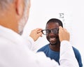 I can see clearly now...an optometrist testing a patients eyesight. Royalty Free Stock Photo