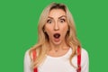 I can`t believe this! Closeup portrait of funny amazed adult blond woman standing with wide open mouth