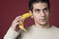 I can't hear you I have a bananna in my ear Royalty Free Stock Photo