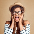 I can only take so much. Studio portrait of an attractive young woman screaming against a gray background. Royalty Free Stock Photo