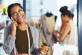 I can totally make that. a fashion designer talking on her phone. Royalty Free Stock Photo