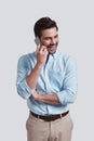 I can totally make it work. Good looking young man talking on s Royalty Free Stock Photo