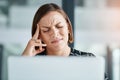 I cant deal with this pain. a young businesswoman suffering with a headache while working in an office. Royalty Free Stock Photo