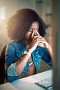 I cant face these late nights any longer. a young businesswoman looking stressed out while working late in an office. Royalty Free Stock Photo