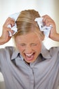 I cant take anymore of this. A frustrated woman screaming and crumpling papers against her head. Royalty Free Stock Photo