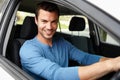 I cant wait to test this car out. Attractive male sitting in his car looking at the camera with his hands on the Royalty Free Stock Photo
