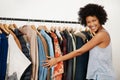 I could open my own clothing boutique. Portrait of a young woman getting dressed at home.