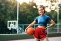 I could stay out here all day. an attractive young sportswoman standing on the court alone and holding a basketball Royalty Free Stock Photo