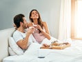 I could wake up like this every day. a happy young couple enjoying breakfast in bed together at home. Royalty Free Stock Photo