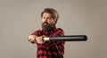 i am dangerous. guy with long beard holding baseball bat. brutal mature hipster