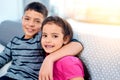 I am definelty my sisters keeper. Portrait of two adorable young siblings posing with their arms around each other while Royalty Free Stock Photo