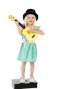 I do it for the fans. Studio shot of a cute little girl playing with her toy guitar against a white background. Royalty Free Stock Photo