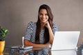 I do it my way. Portrait of a confident young businesswoman sitting at her office desk. Royalty Free Stock Photo