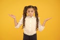 I do not know. Puzzled or confused. Perfect schoolgirl tidy fancy hair puzzled face expression. School stranger