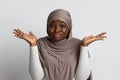 I Don`t Know. Doubtful Black Muslim Lady Shrugging Shoulders And Spreading Arms Royalty Free Stock Photo