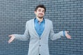 I don`t know. Portrait of confused handsome bearded man in casual style standing, raised arms and looking at camera with doubtful