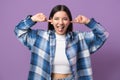 I don't want to hear. Childish behaviour from a young woman 29s, sticking fingers in ears and showing her tongue Royalty Free Stock Photo