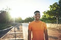 I dont feel this good while sitting around and avoiding exercise. a young man smiling while our for a workout. Royalty Free Stock Photo