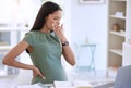 I dont feel so good. a young pregnant businesswoman sitting alone in her office and covering her mouth with her hand. Royalty Free Stock Photo