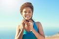 I dont ride without my brain bucket. a young woman putting on her helmet before her ride. Royalty Free Stock Photo