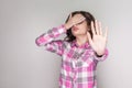 I dont want to see it. confused girl with pink checkered shirt s Royalty Free Stock Photo